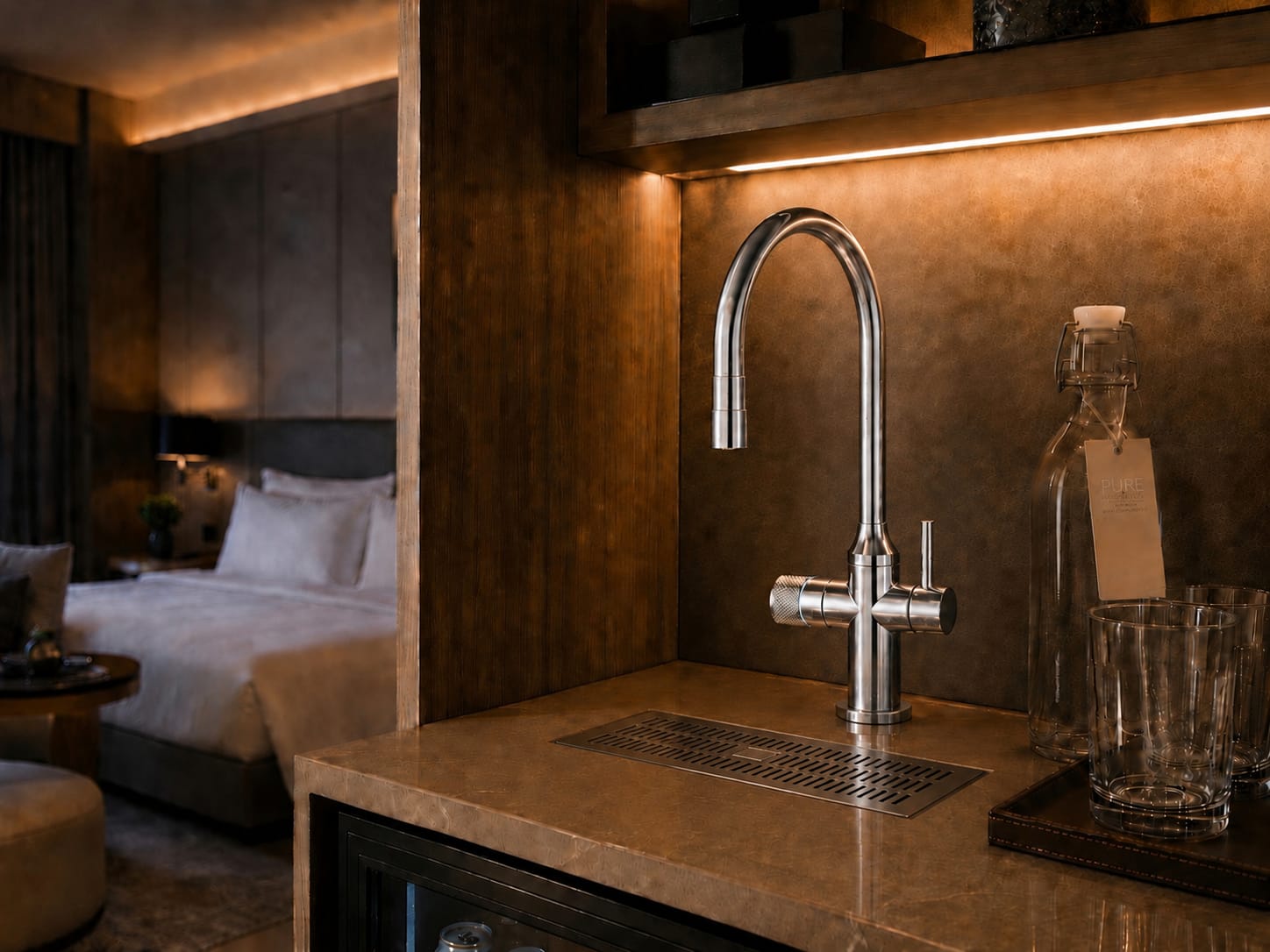 Modern hospitality faucet filling a reusable glass bottle